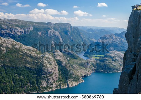 Stunning view of the Preikestolen or Prekestolen (Preacher's Pulpit or Pulpit Rock) above the Lysefjord, in Forsand municipality; Rogaland county, nature and travel background, Norway Royalty-Free Stock Photo #580869760