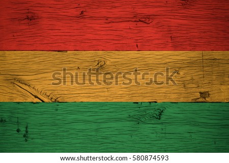 Bolivia civil flag painted on old oak wood. Painting is colorful on planks of old train carriage.