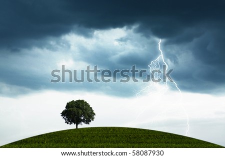The natural landscape with the storm, overcast sky and lonely tree Royalty-Free Stock Photo #58087930