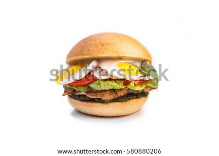 Close up, isolated, burger with egg, salad, tomato, meat on white background