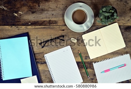 Office stuff and it gadgets display on top view business desk with copy space at text of picture. Creative table, modern project. Business empty vintage is background. Dark tone.flat lay.