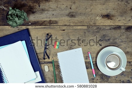 Office stuff and it gadgets display on top view business desk with copy space at text of picture. Creative table, modern project. Business empty vintage is background. Dark tone.flat lay.