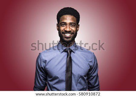 Beautiful business man in front of a colored background
