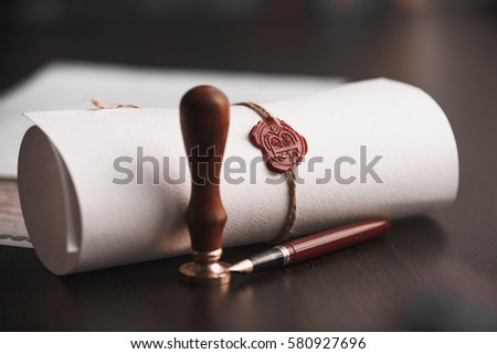 Old notarial wax seal on tied scroll, closeup