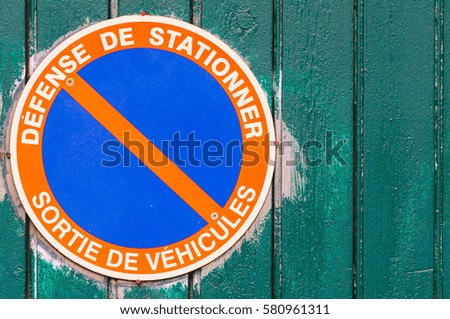 French no parking sign, the text means " not park, car's exit".