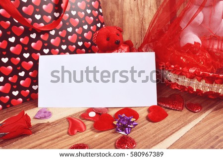 Teddy bear with hearts and card isolated beautifully