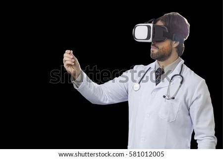 Male doctor using a Virtual Reality Glasses on a black background.