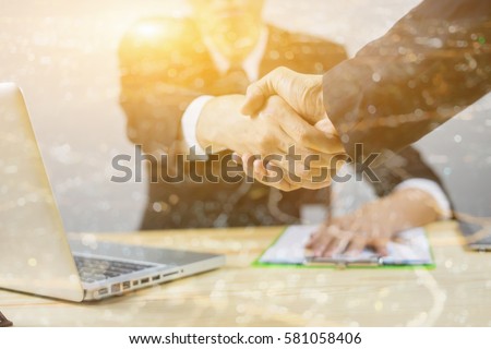 Great job,Sealing a deal,Successful business,Handshake,Businessman join together,Good agreement.two business people shaking hands standing at the working place,selective focus,Vintage ,double exposure