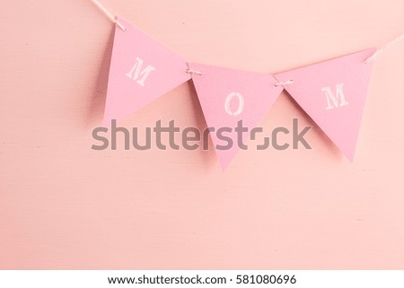 Decorations for Mother's Day on a  wood board.