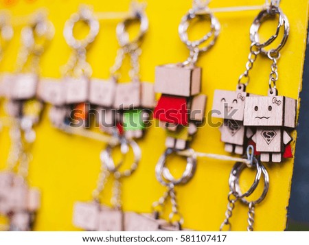 Close up Souvenir Key Holder Dolls and wood key chain
