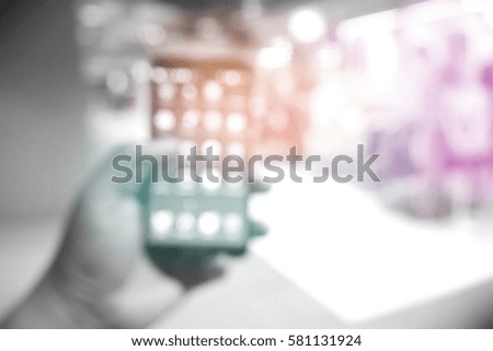 Picture blurred  for background abstract and can be illustration to article of people use phone in mall