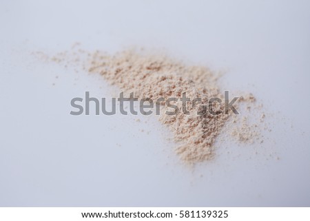 Cosmetics powder on white background