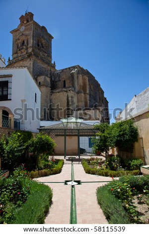 Andalusi garden with San Pedro church in the background in Arcos de la Frontera, Cadiz - Spain