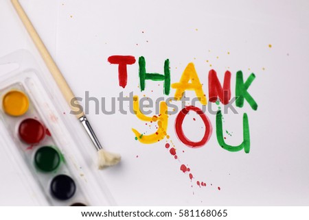 inscription on a white sheet of paper with watercolors "Thank you"