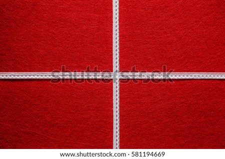 White ribbon bow on a red gift background