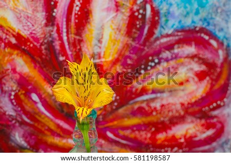 Live natural real beauty yellow bright orange flower Bud in the foreground, on a background of textured pattern with red pink flower and blue background. Eco, spring, summer, love, woman day, art. 