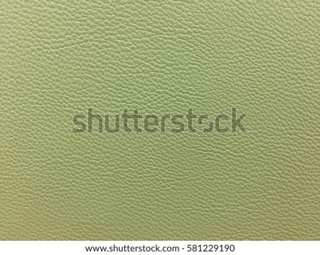 Green leather texture background surface.