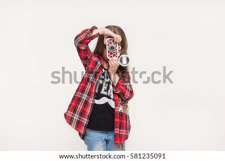 Beautiful child girl holding a instant camera