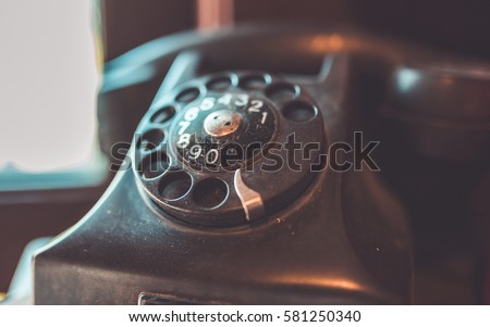 Retro rotation telephone in vintage style picture.