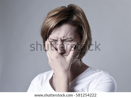 young devastated depressed woman crying sad feeling hurt suffering depression in sadness emotion gesturing helpless in pain face expression isolated background desperate Royalty-Free Stock Photo #581254222