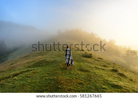 Girl meets morning in the mountains