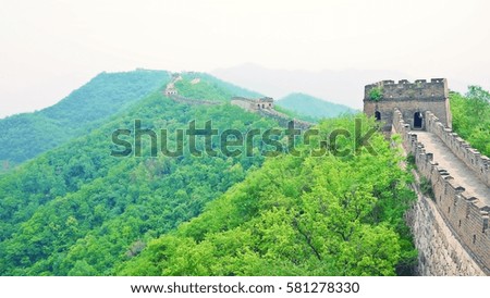 The Great Wall of China at Mutianyu Section near Beijing. Greenery mountain background.