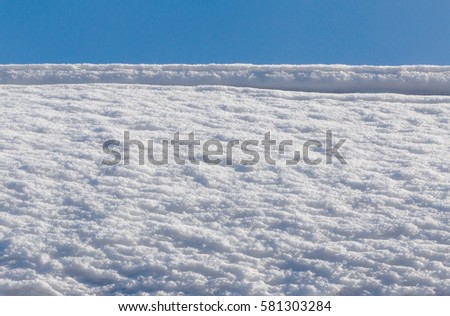 heap of snow over blue sky