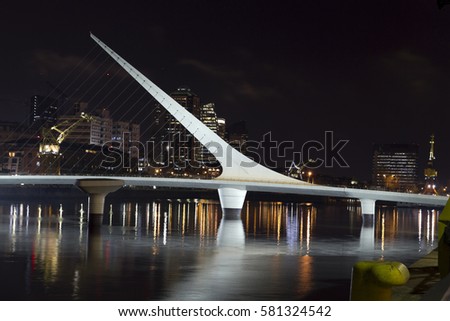 The woman bridge. Puerto Madero is a district at Buenos Aires, Argentina, occupying a portion of the Río de la Plata riverbank and representing the latest architectural trends in Buenos Aires