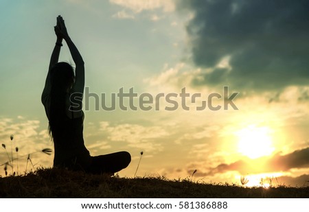 silhouette of free cheering woman hiker open arms at mountain peak beautiful sky background 