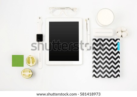 Top view of white office table with laptop