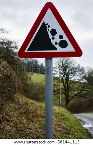 Falling rocks warning road sign colour