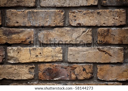 Picture of an old wall made out of brown bricks