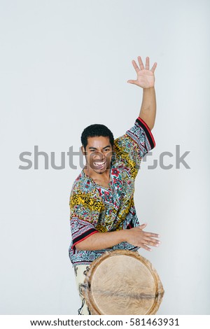 Portrait of young musician with Djembe drum