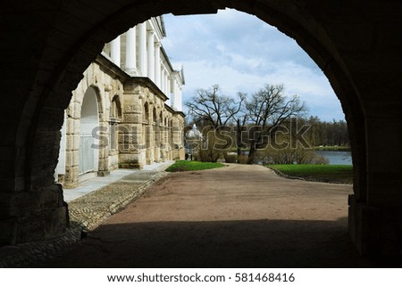 Photo through the arch of the Catherine Palace on the Great Pond and Grotto pavilion of the Catherine Park. Pushkin (Tsarskoe Selo). 