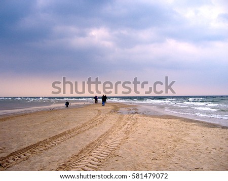 Beach of Grenen: this sandbar is the junction point between the strait of Skagerrak (part of North Sea) and the Kattegat sea. Skagen, Denmark. Royalty-Free Stock Photo #581479072