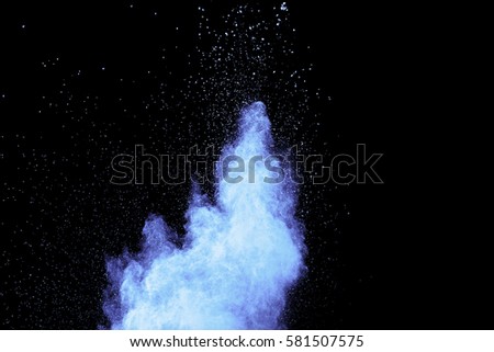 abstract blue dust explosion on  black background.abstract blue powder splatted on black background,Freeze motion of blue powder exploding.