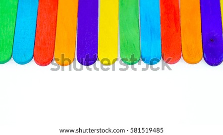 Design of colorful background made up from ice cream stick isolated white background