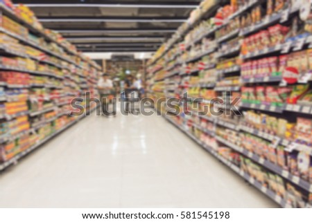 blurred image of supermarket people shopping