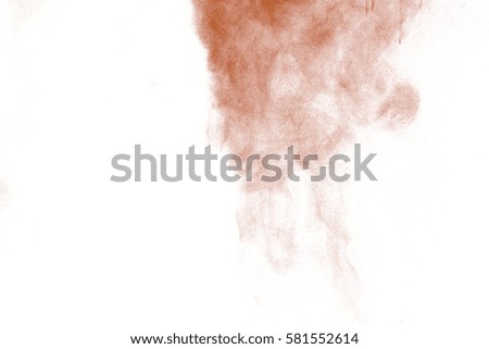 abstract brown dust explosion on  black background.abstract brown powder splatted on black background,Freeze motion of brown powder exploding.