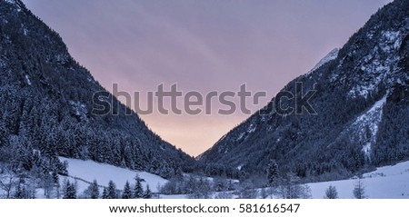 Pink sunset in winter Alps