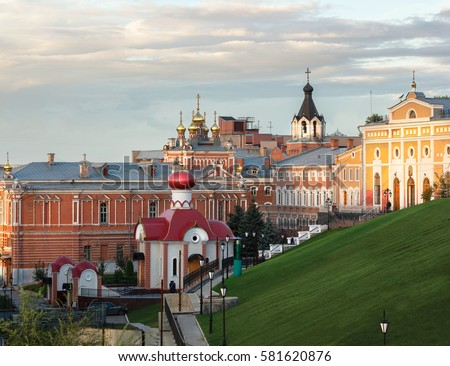 Iversky Women's Monastery in Samara (Russia, September 2016) autumn evening on a background of the cloudy sky, lit by the setting sun Royalty-Free Stock Photo #581620876