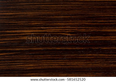 Dark ebony wood background, exclusive natural texture with patterns. Extremely high resolution photo.
