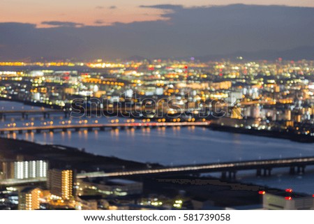Abstract blurred bokeh lights Osaka city aerial view, Japan