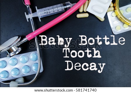 Baby Bottle Tooth Decay word, medical term word with medical concepts in blackboard and medical equipment