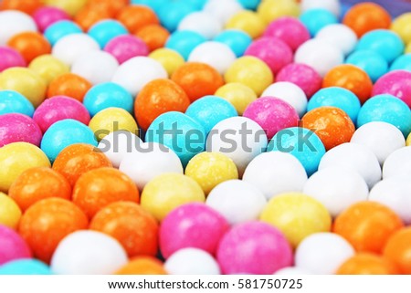 Bubble gum chewing gum texture. Rainbow multicolored gumballs chewing gums as background. Round sugar coated candy bonbon bubblegum texture. Colorful multicolor bubblegums wallpaper. Candy background