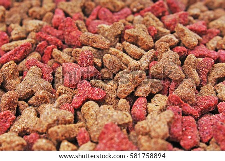 Cat food, granule, as background. Cat food texture pattern. Dry pet food textures studio photo.

