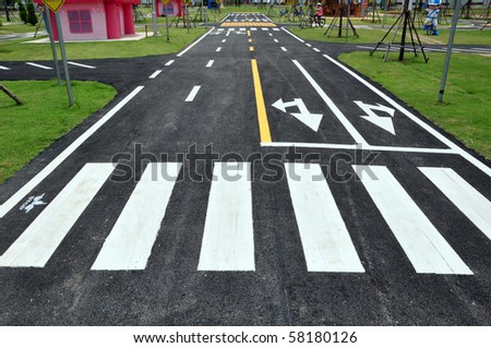 zebra way on the asphalt road surface Royalty-Free Stock Photo #58180126