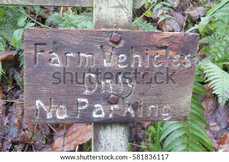 "Farm Vehicles Only , No Parking" Sign in the Remote Snowdrop Valley near Wheddon Cross,within Exmoor National Park in Rural Somerset, England, UK