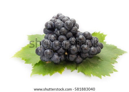 Black grapes bunch isolated on white background with green leaf package design element