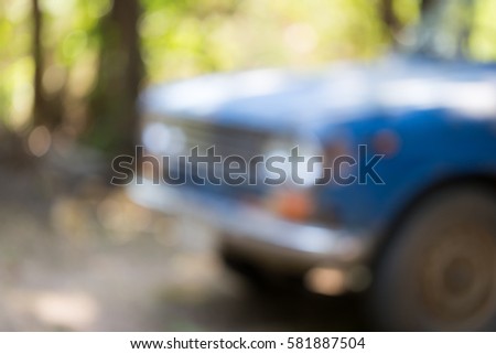 Blurry Attractive blue old retro car background Royalty-Free Stock Photo #581887504